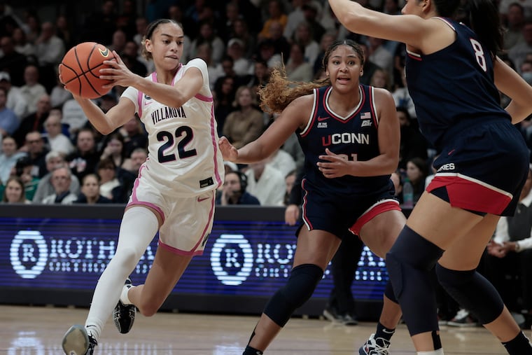 Villanova's Kennedy Henry drives past UConn's Sarah Strong (center) and Jana El Alfy during Wednesday's game.