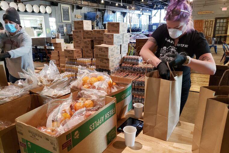 Alison Gutsche, general manager at Craft Hall, packs orders for the first ServeBetter event in April.