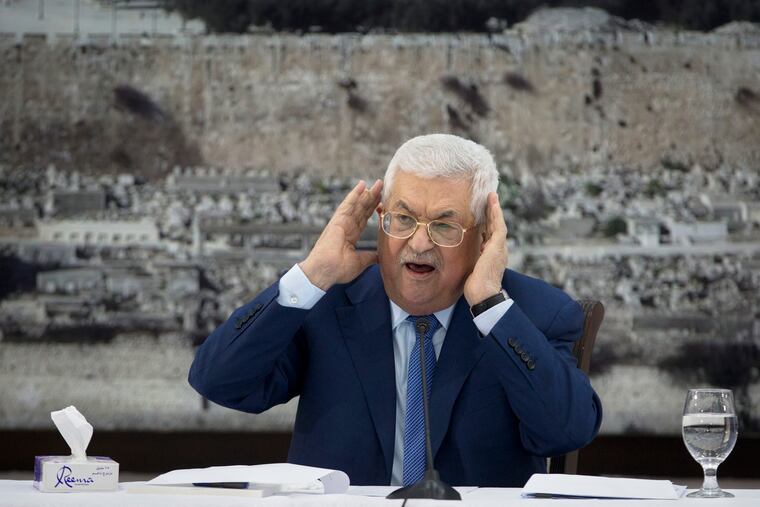 FILE - In this Dec. 22, 2018 file photo, Palestinian President Mahmoud Abbas gestures as he speaks during a meeting of the Palestinian leadership in the West Bank city of Ramallah. The Western-backed Palestinian Authority is threatening to step up pressure on Hamas amid renewed tensions in Gaza, even as Israel allows a lifeline of Qatari aid to flow directly to the Islamic militants. Abbas wants to reassert his authority over Gaza, while Israeli Prime Minister Benjamin Netanyahu seeks to preserve calm ahead of April's elections. (AP Photo/Majdi Mohammed, File)