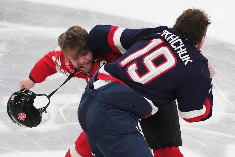 Canada's Brandon Hagel (left) and the United States' Matthew Tkachuk fight during the first period of their 4 Nations Face-Off game Saturday in Montreal.