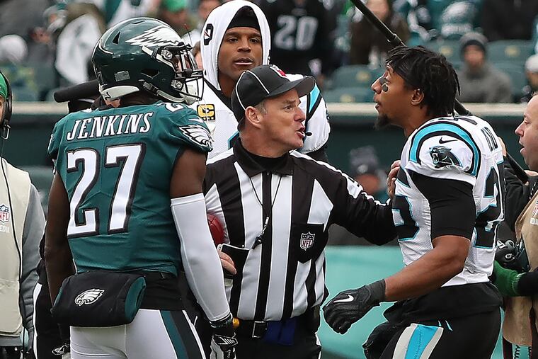 Malcolm Jenkins (left) and Eric Reid argue during the coin toss.