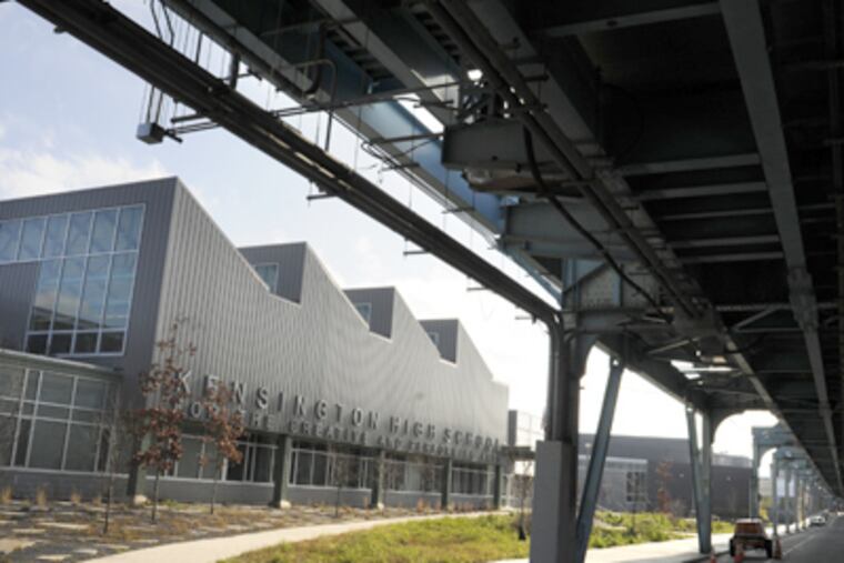 Kensington High School for the Creative and Performing Arts includes green roofs whose native plants conserve rainwater. (Tom Gralish / Staff Photographer)