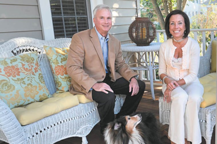 Elaine and Mike Tracy on the front porch of their Collingswood home with their 13-year--old dog Hershey. (Sharon Gekoski-Kimmel / Staff Photographer)