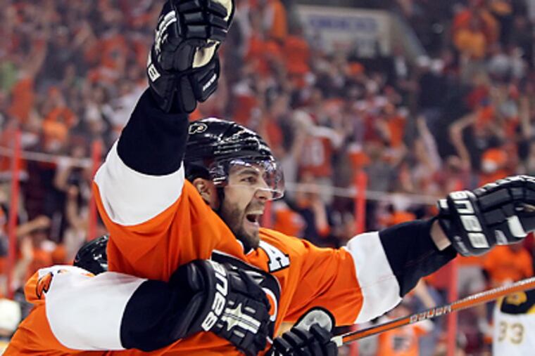 Simon Gagne scored the game-winning goal during overtime of Game 4 against the Bruins. (Steven M. Falk / Staff Photographer)