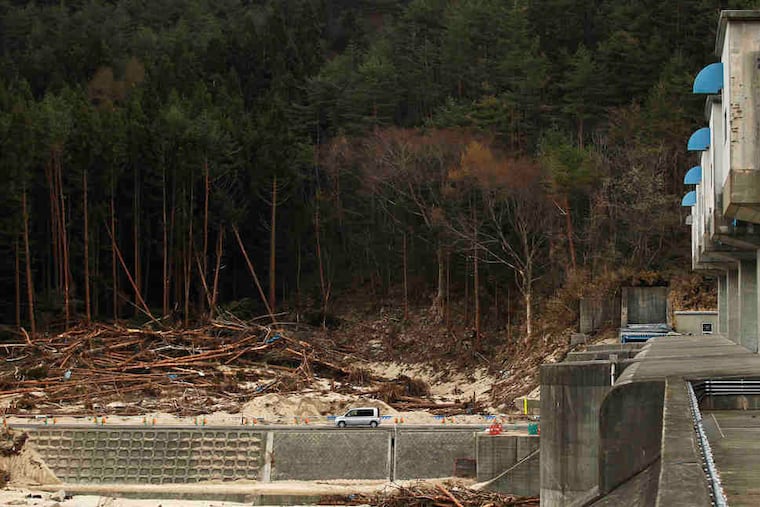 Tsunami destruction was limited to the seaward side of the enormous floodgate in Fudai, in northern Japan. The 51-foot-high structure built in the 1970s at a cost of more than $30 million in today's dollars spared the town of 3,000.