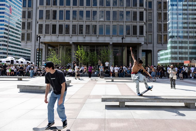 Skaters trying out the newly renovated skate plaza on Friday at the Municipal Services Building.