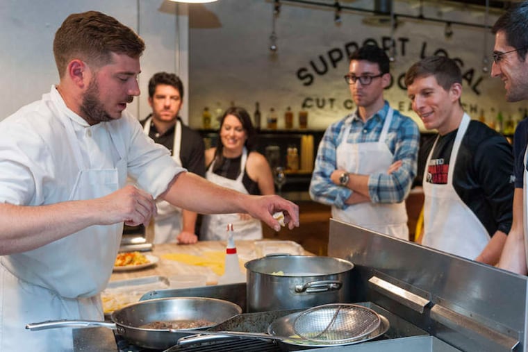 Chef Damon Menapace leads a class at Kensington Quarters with (from left) Dan Hershberg, Christine Blechman, Adam Falkowitz, Greg Steigerwalt, Charles Cycom. ( Photo by Matthew J Rhein )