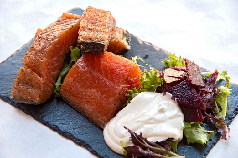 A plate of Gravlax, consisting of cured salmon with pickled beets and sour cream prepared by Joncarl Lachman as part of his Nordic Easter brunch. He is owner and chef of Noord Eetcafe in South Philadelphia.