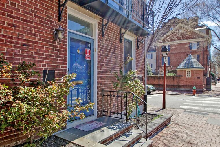 The property includes deeded parking in a gated lot and a re-landscaped patio and garden out back. Upstairs off the master bedroom, a large balcony overlooks the Society Hill neighborhood.