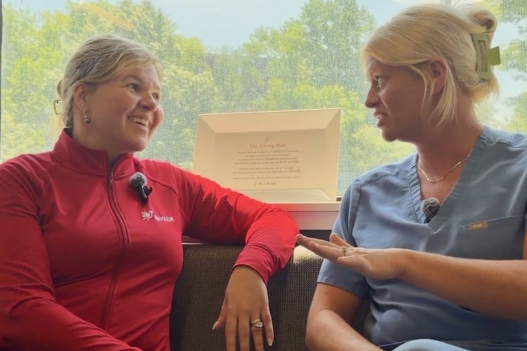 Bryony Winn (left) who became CEO of Bayada Home Health Care in March, speaks with Alex Recke, a therapist in the organization's behavior analysis unit in Pennsauken.