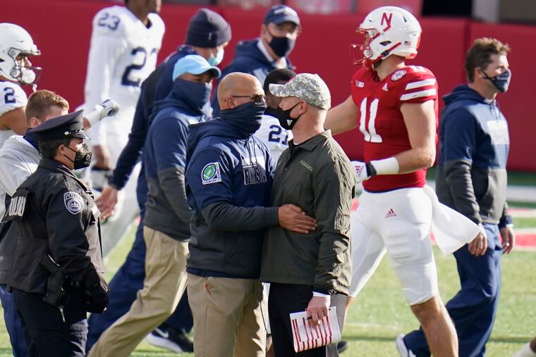 Penn State coach James Franklin (left) talks with Nebraska coach Scott Frost after Penn State's 30-23 loss on Saturday.