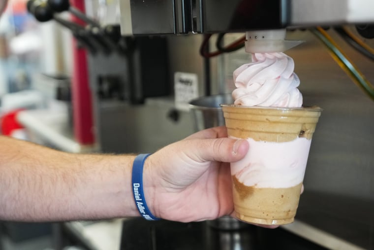 Miles Smith, makes a gelati with cold brew water ice and strawberry ice cream, at Cherry's Ice Cream & Water Ice, in Cherry Hill New Jersey, April 21, 2026.