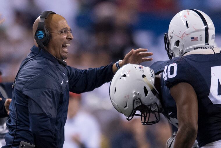 Penn State coach James Franklin celebrates with his defensive unit after they stopped Wisconsin on a 4th-down play in the 4th quarter of the Big Ten Championship game at Lucas Oil Field in Indianapolis December 3, 2016. CLEM MURRAY / Staff Photographer