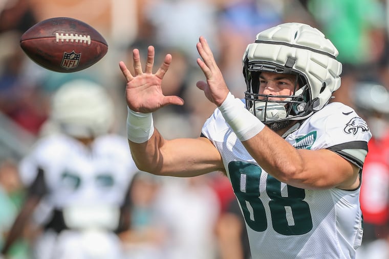 Eagles tight end Dallas Goedert pulls in a pass during training camp at the NovaCare Complex on Aug. 22.