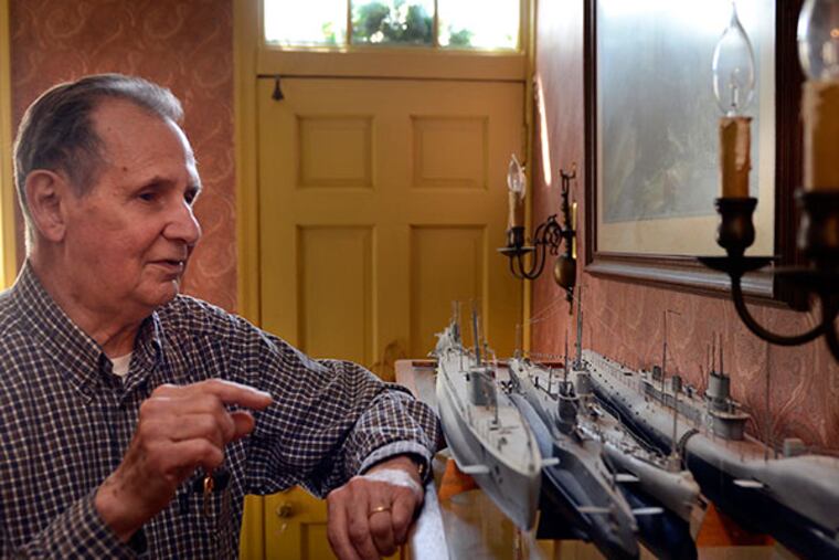 Edwin Leaf with some model submarines in his Edgewater Park home April 17, 2014. The octogenarian's work will be on display at Philadelphia International Airport. ( TOM GRALISH / Staff Photographer )