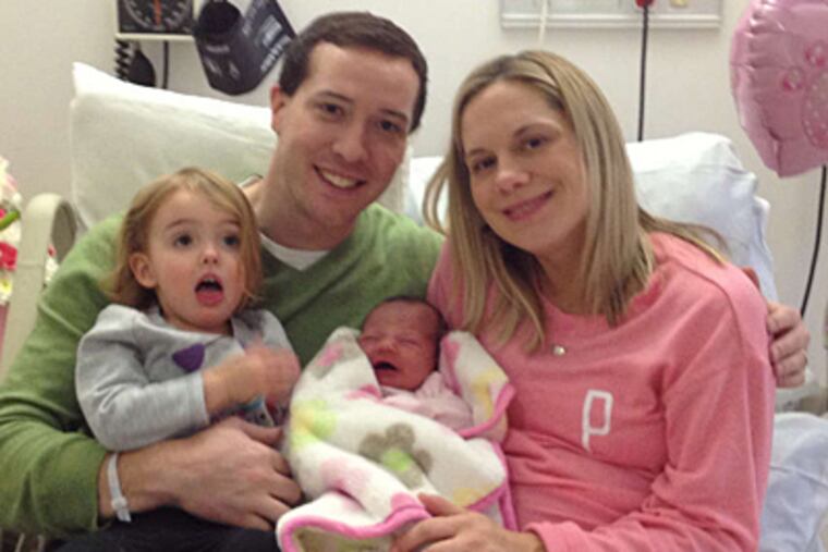 Sara and Greg Stokes with new daughter Marguerite Lynn and older sister Bridget. Young Maggie Lynn arrived at 12:05 a.m., Jan. 1, at Abington Memorial Hospital.