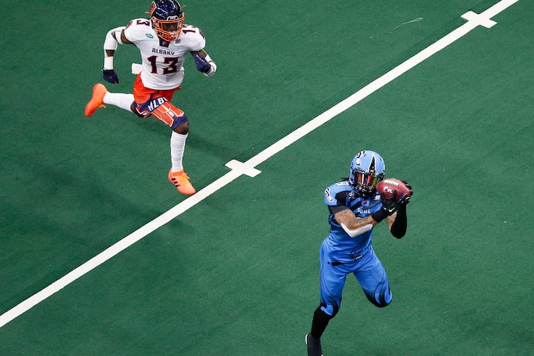 Soul wide receiver Lonnie Outlaw catches a touchdown pass in the third quarter after getting behind Albany Empire defensive back Juwan Offray.