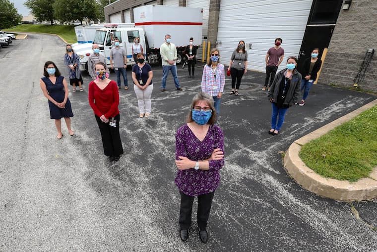 Jeanne Casner, foreground, director of the Chester County Health Department, which also is handling COVID-19 response for Delaware County in suburban Philadelphia, with some of her 100-person-strong coronavirus team behind her: in no particular order: Alexandria Tavoni; Heather DeStefano; Dave Sekkes; Kelly Raum; Dr. Renee Cassidy; Eric Misthal; Michele Steiner; Rachael Hernandez; Suzy Curtis; Gianna Megaro; Bill Boyer; Mike Baysinger; Stephanie Steiner; and Meghan Smith in West Chester, Thursday, May 28, 2020