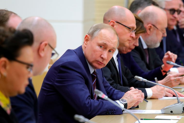 Russian President Vladimir Putin attends a meeting on drafting constitutional changes at the Novo-Ogaryovo residence outside Moscow on Thursday. At the meeting, Putin proposed a set of constitutional amendments that could keep him in power well past the end of his term in 2024.