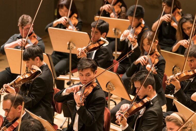 Musicians of the Curtis Institute Orchestra, performing earlier this year. At least two patrons recently sat out the traditional concert-opening national anthem. (KAI BIENERT)