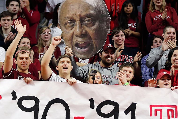 Fans honor the 1990-91 Elite Eight men's basketball team with a large
photograph of former Temple Head Coach John Chaney.