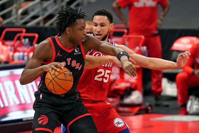 Toronto Raptors forward OG Anunoby (3) works against the 76ers' Ben Simmons (25) during the first half of their game on Sunday, Feb. 21, 2021, in Tampa, Fla.