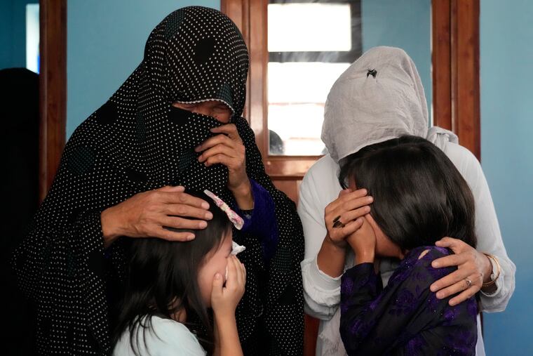 The family of a 19-year-old who was a victim of the suicide bomber mourns in Kabul, Afghanistan.