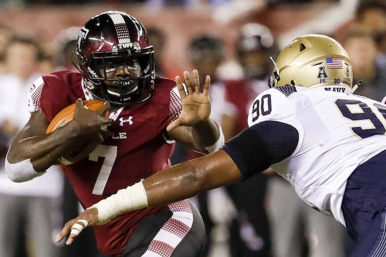 Temple running back Ryquell Armstead holds the football watching Navy defensive end Jarvis Polu during the second-quarter on Thursday, November 2, 2017 in Philadelphia. YONG KIM / Staff Photographer