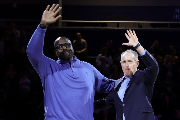 Former Drexel star Malik Rose (left) and coach Bill Herrion acknowledge the crowd Saturday at the Daskalakis Athletic Center.
