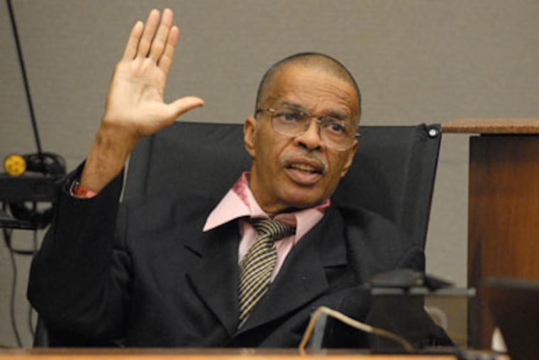 Atlantic City councilman Eugene Robinson is sworn in to testify at the trial of three men accused in an alleged conspiracy to blackmail him, in Mays Landing, NJ. (AP Photo/The Press of Atlantic City, Danny Drake, file)