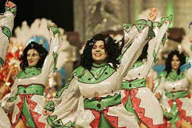 The Saturnalian Fancy Brigade shake their stuff at the parade last year. (Michael Bryant / Staff Photographer)
