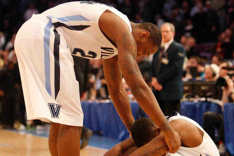 Villanova's Corey Stokes tries to console Maalik Wayns after Wayns missed a 20-foot shot at the buzzer.