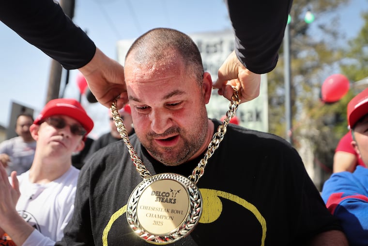 Chris Furia, of Media, Pa., wins the amateur event after nearly finishing three foot-long sandwiches.