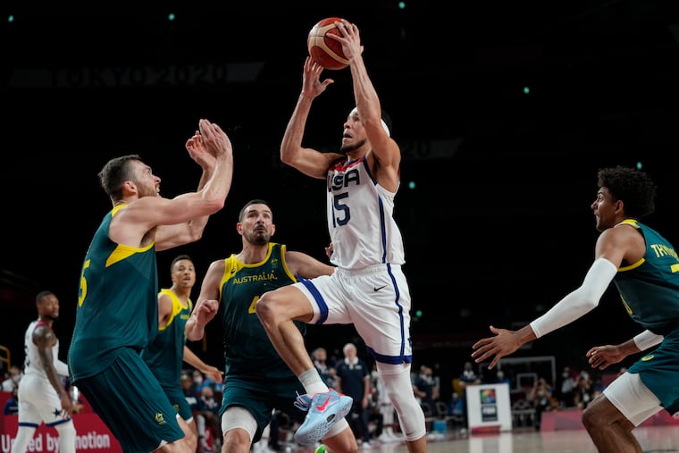 Devin Booker (15) drives to the basket during the U.S. men's basketball team's semifinal win over Australia.