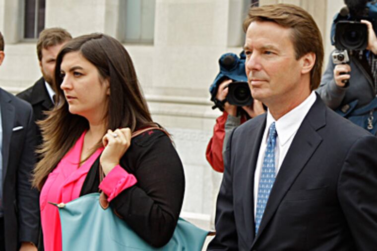 Former Sen. John Edwards leaving federal court in Greensboro, N.C., with his daughter Cate on Monday. He is on criminal trial. CHUCK BURTON / Associated Press