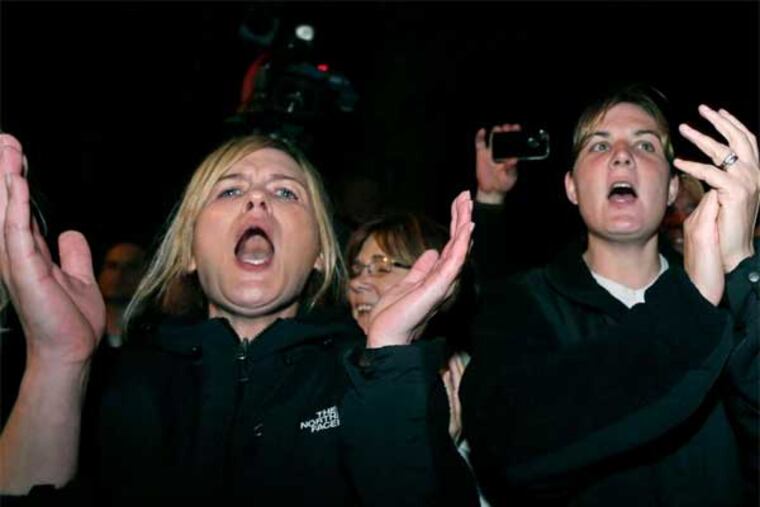Crowd in Watertown, Mass., erupts after the arrest of Dzhokhar Tsarnaev, the suspect in the Boston Marathon bombings. (Associated Press)