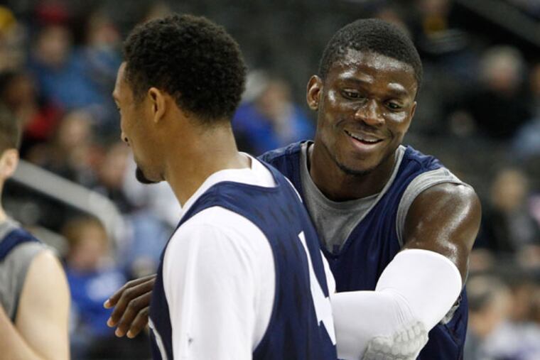 Villanova's Mouphtaou Yarou (right) jokes with Darrun Hillard. (Ron Cortes/Staff Photographer)