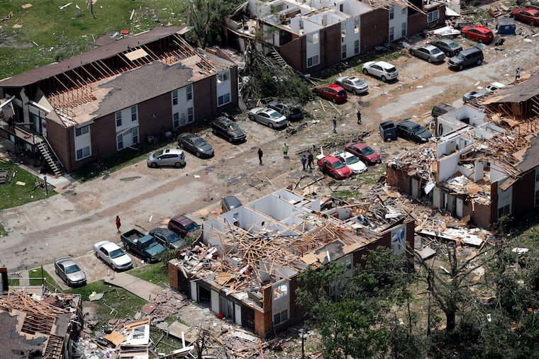 This aerial image shows severe storm damage in Jefferson City, Mo., Thursday, May 23, 2019, after a tornado hit overnight. A tornado tore apart buildings in Missouri's capital city as part of an overnight outbreak of severe weather across the state. (AP Photo/Jeff Roberson)