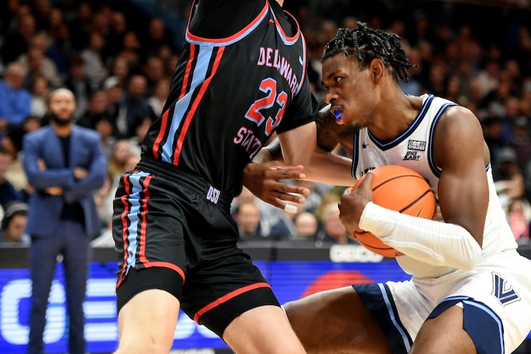 Villanova’s Brandon Slater (right) runs up against Delaware State’s Brandon Stone under the basket during the 2nd half at Finneran Pavilion Monday Nov. 14, 2022.