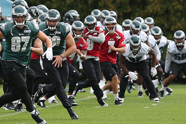 The players warm up during Eagles practice.