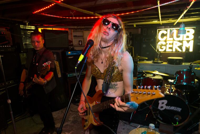 The basement of a Pennsauken house has become a makeshift punk club called Club Germ. K.C. Germ, a.k.a, Casey Fleming (left) and Ugli's Dylan Wagner performed there on Saturday.