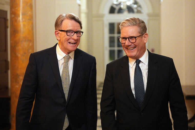 Prime Minister Keir Starmer (right) talks with Britain's ambassador to the U.S., Peter Mandelson, during a welcome reception at the ambassador's residence in Washington last February.