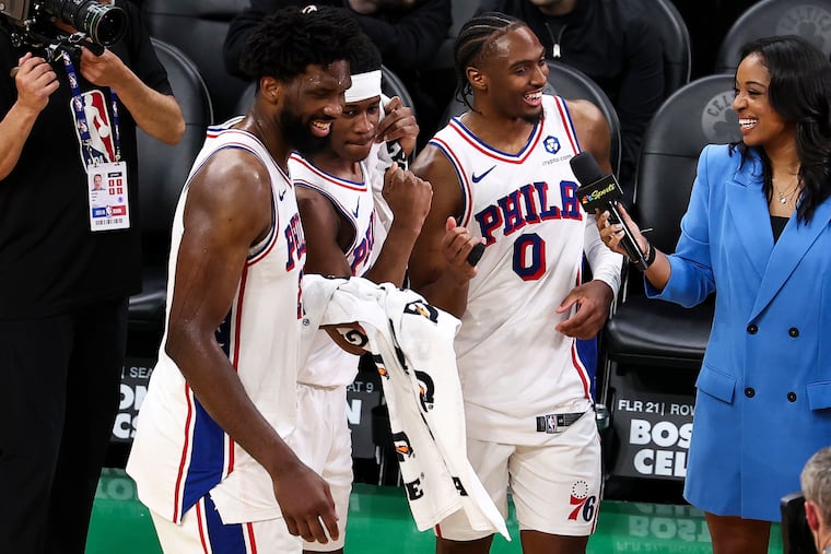 After all is said and done, Sixers center Joel Embiid, celebrates with two of his costars, VJ Edgecombe and Tyrese Maxey on Saturday at TD Garden. The Sixers beat the Boston Celtics, 109-100, to advance to the Eastern Conference semifinals.