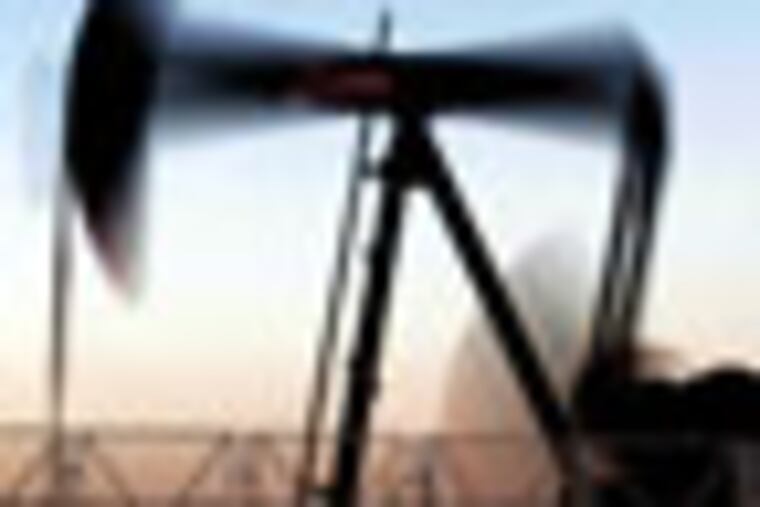 An oil pump works at sunset Tuesday, Feb. 21, 2012, in the desert oil fields of Sakhir, Bahrain. Oil prices are now at the highest level for many months on concerns that Iran will cut off oil supply which would have been destined for parts of Europe, a largely symbolic act, but an act which continues the upward pressure on oil prices. (AP Photo/Hasan Jamali)