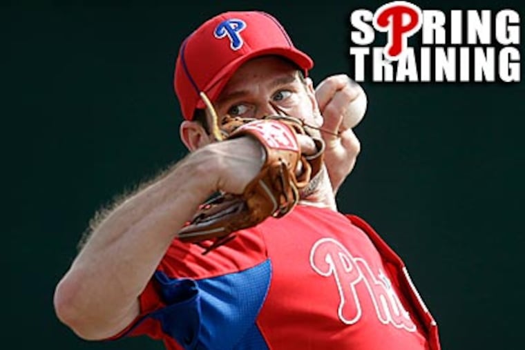 Cliff Lee's bullpen session was a popular attraction Sunday afternoon. (Matt Slocum/AP)