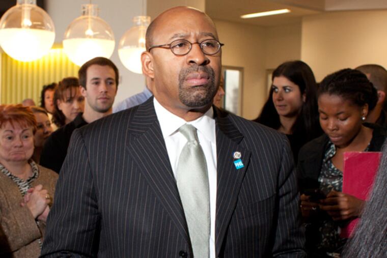 The opening of the new Iroko Pharmaceuticals building in the Navy Yard Wednesday afternoon December 12th. Here, Mayor Nutter awaits his introduction.( ED HILLE / Staff Photographer )