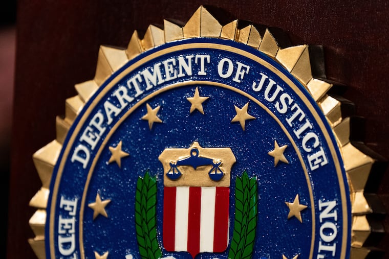 FILE - An FBI seal is displayed on a podium before a news conference at the field office in Portland, Ore., Thursday, Jan. 16, 2025. (AP Photo/Jenny Kane, File)