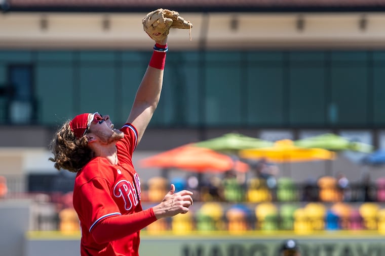 Phillies third baseman Alec Bohm catches a fly ball against the Tigers on Friday in a 6-6 tie to open the spring training schedule.