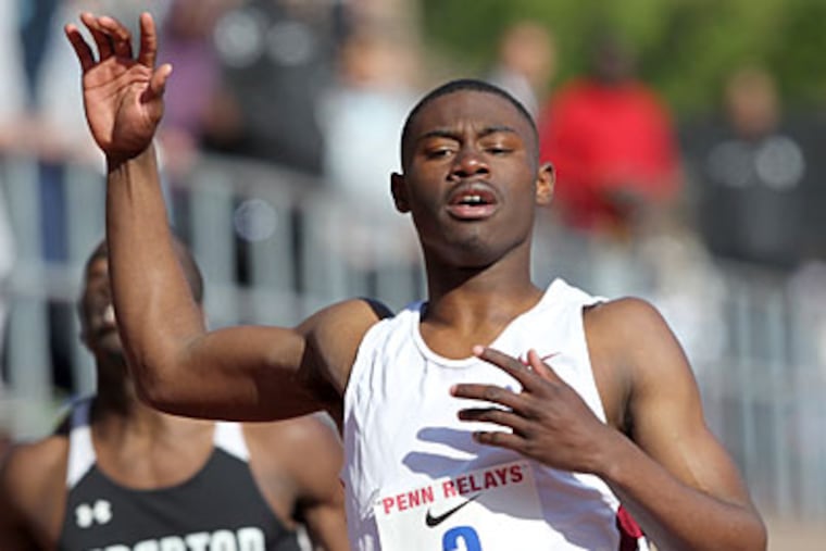 Penn Wood's Eric Hutch crosses the finish line to win the high school boys' 400m hurdles championship. (Charles Fox/Staff Photographer)