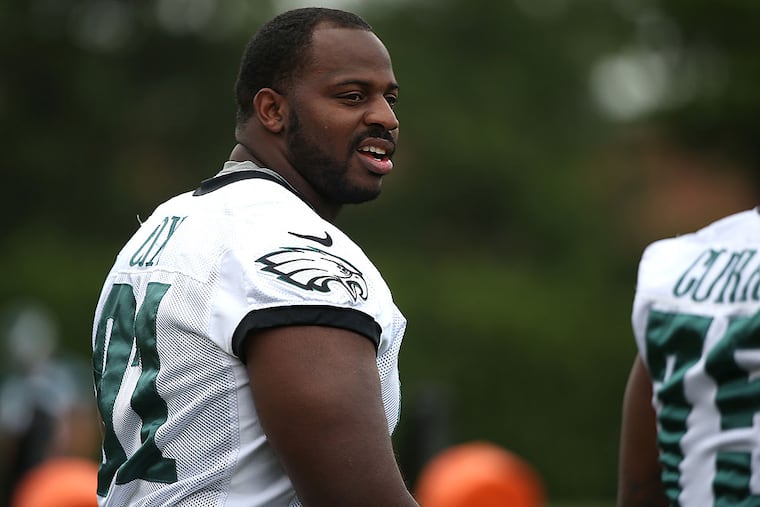 Fletcher Cox walks out to the field before the start of the Eagles minicamp at the NovaCare Complex.